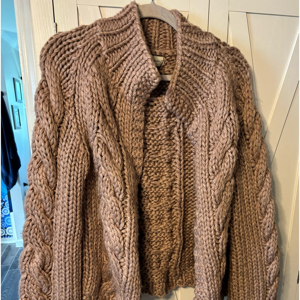 Women’s medium cable knit open front sweater.